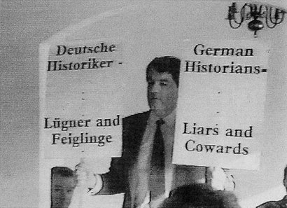 Irving placards: 'German Historians: Liars and Cowards'
