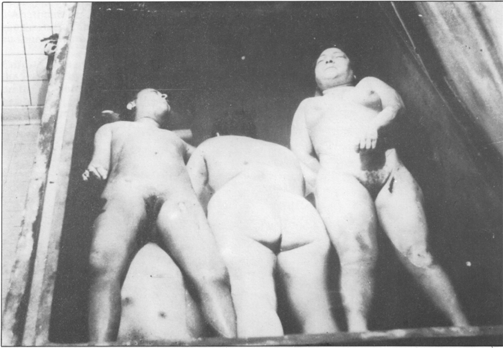 Female cadavers in vat