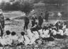 A German policeman shoots individual Jewish women 