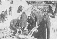 Plump SS-women bury skeletal corpses in Belsen